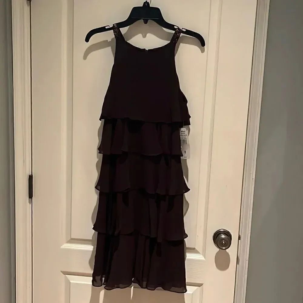 Beautiful brown flouncy dress. Never worn. Size 8